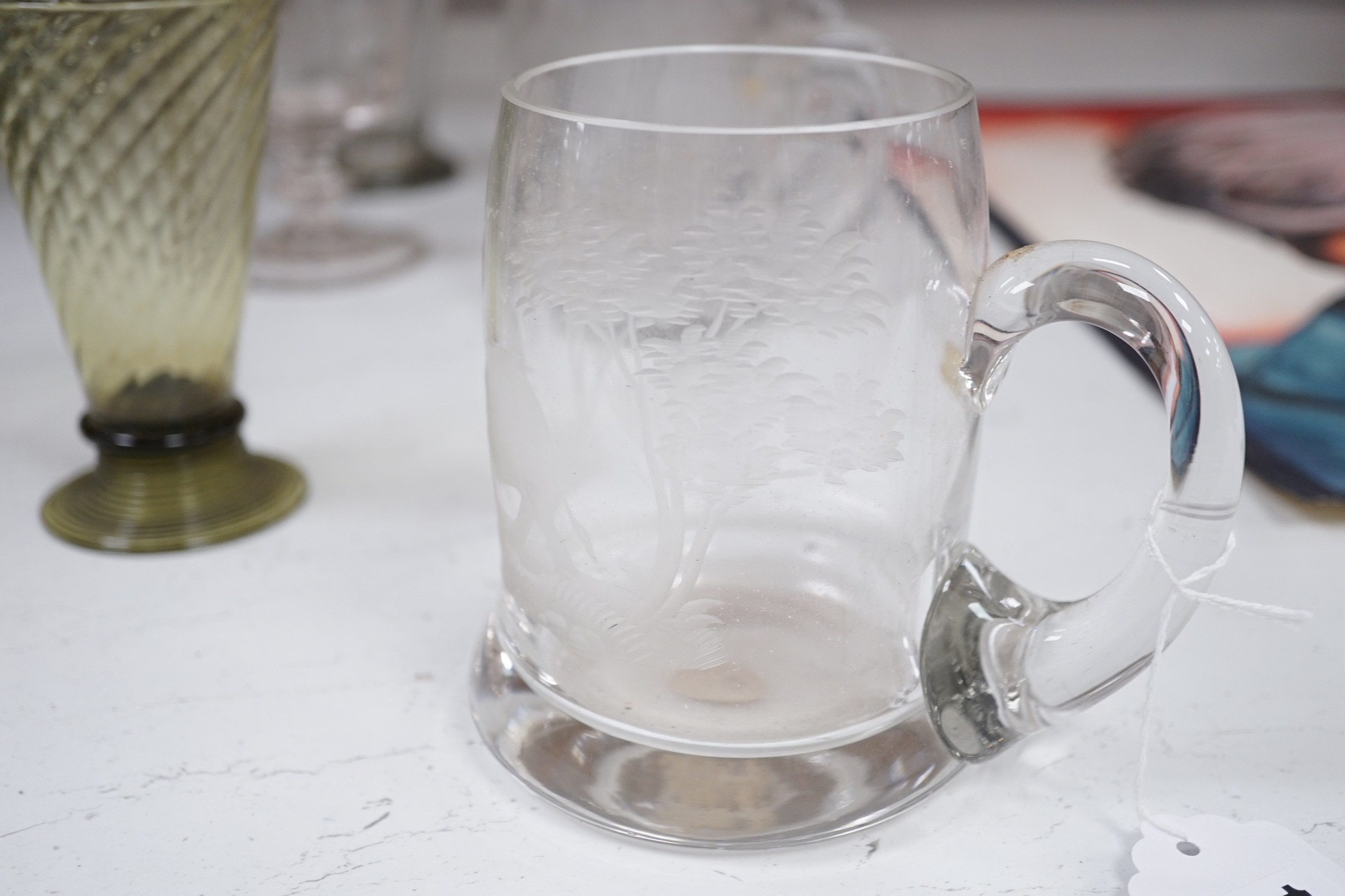 A set of four engraved glass mugs, a pair of rummers, an oval biscuit box etc